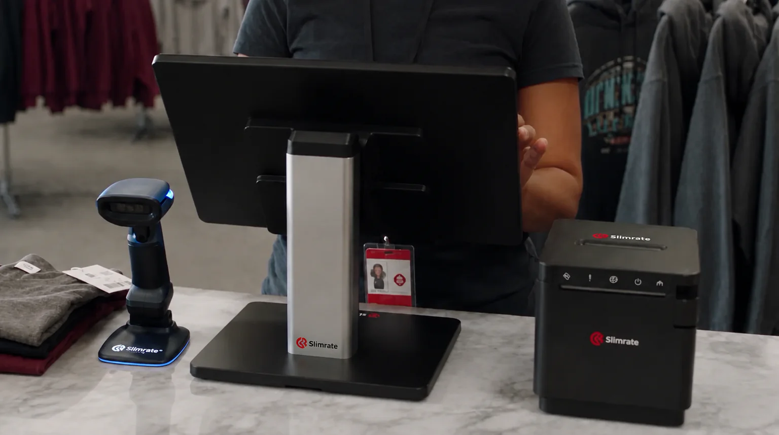Slimrate POS terminal, barcode scanner, and receipt printer at a retail checkout counter
